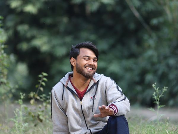 Smiling woman sitting comfortably with good posture